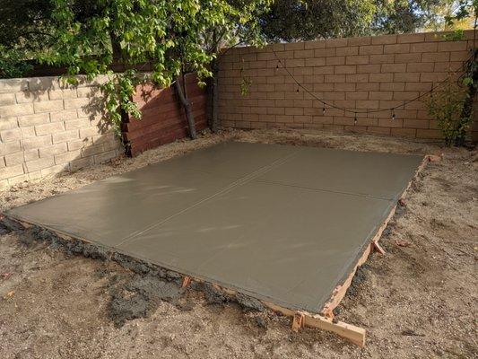 Newly finished concrete pad for shed in Calabasas.