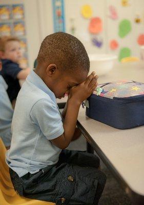 Prayer before snack time.