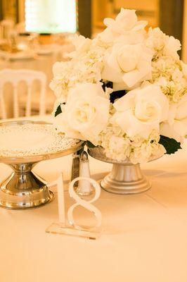 Centerpieces with mirror table numbers.