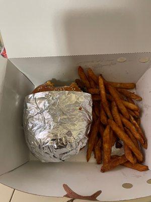 Burger and seasoned fries.