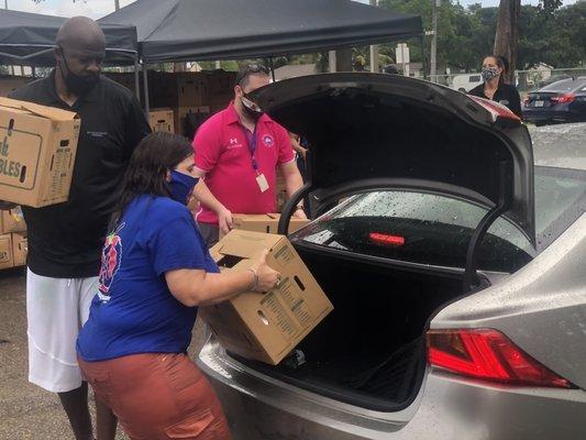 President Anna Fusco helping to feed families in Sunrise.