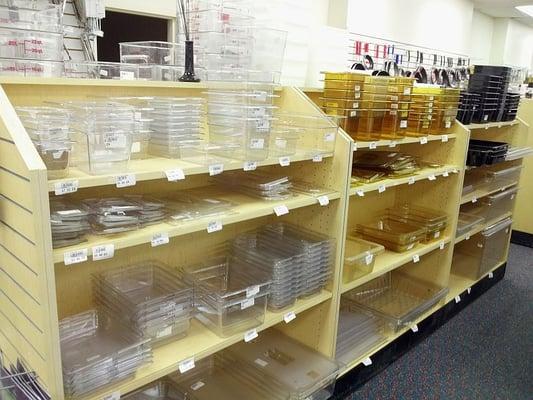 Row upon row of restaurant and food service supplies. These are food storage containers.