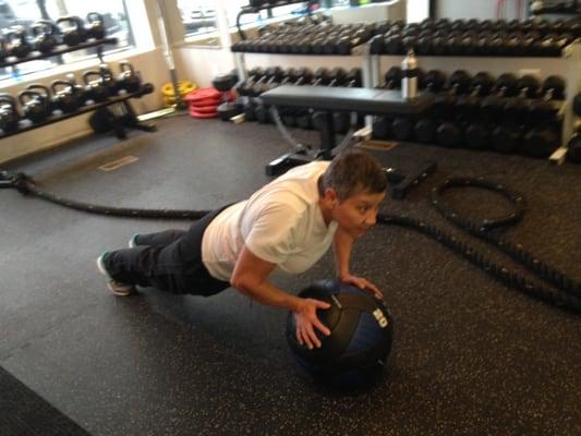 Melba working of upper strength and core development using a medicine ball.