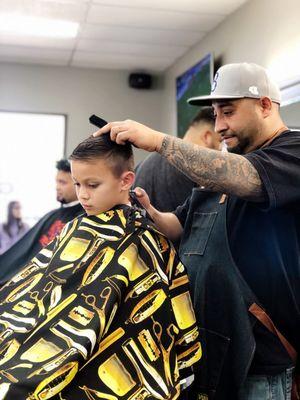 Manny at work. Super friendly & did a fantastic job with my son's hair!