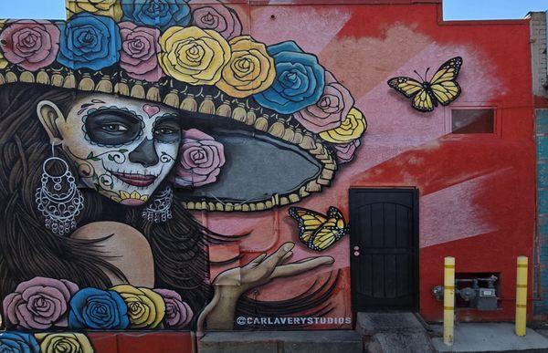 calavera mural along the dumpster alley of Los Mariachis