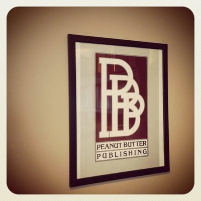 Framed Peanut Butter Publishing logo, on the wall at Peanut Butter Publishing office, Seattle, WA.