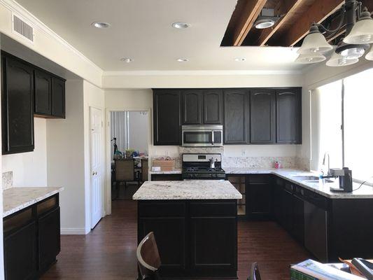 Oak kitchen after refinished to espresso color.