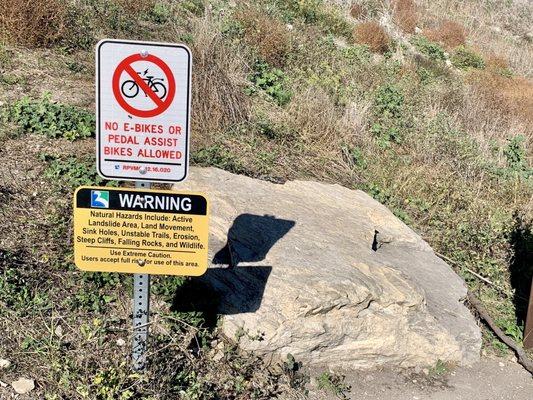 Warning Signages (no e-bikes or pedal assist bikes; natural hazards warning)