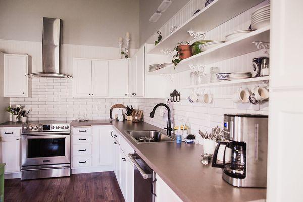 We painted this customer's oak cabinets, then re-positioned them, to create this beautiful partial kitchen remodel.