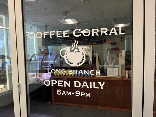 Coffee Corral outside with store hours -September 2022