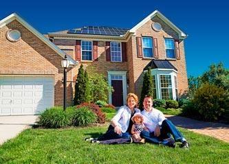 Family in front of New Jersey house with solar energy system