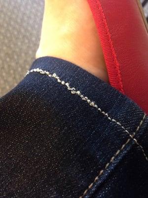 Close up of the hem stitches on my jeans. Really terrible work.