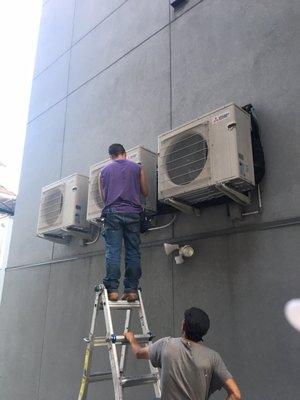 My hired HVAC contractor fixing the electrical wires.