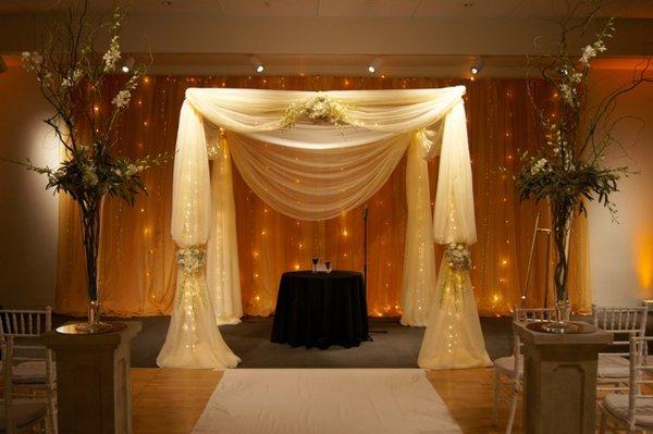 Chuppah with matching backdrop drape and lighting