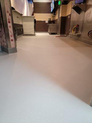 Finished Urethane Cement over quarry tile in a commercial kitchen.