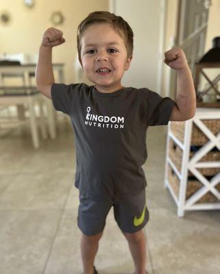 Our 3 year old proudly showing off his muscles and t-shirt