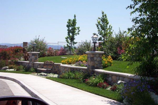 Concrete, masonry, lighting, planting, sod, irrigation, etc.