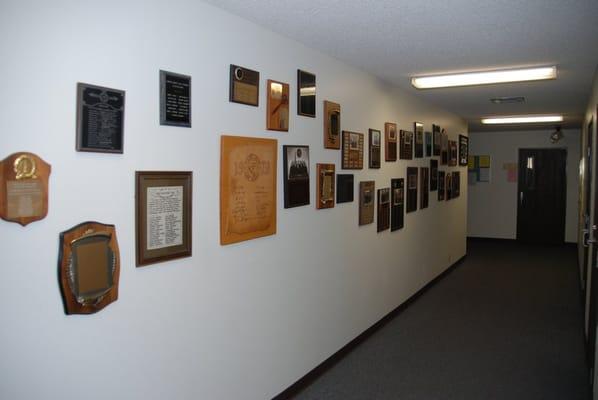 Wall of plaques - graduating classes since 1974.