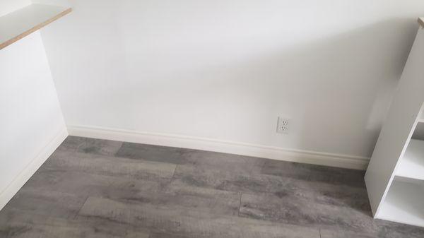 Install laminate flooring and baseboard