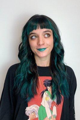 Emerald green vivid to match her lipstick!