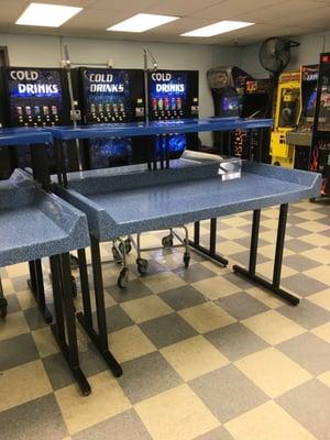 6 folding tables, lots of rolling baskets, a few video games and 5 vending machines.