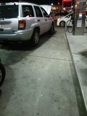 If you're going to repair you car at the pump, at least pull up so the car behind you can gas up like normal...