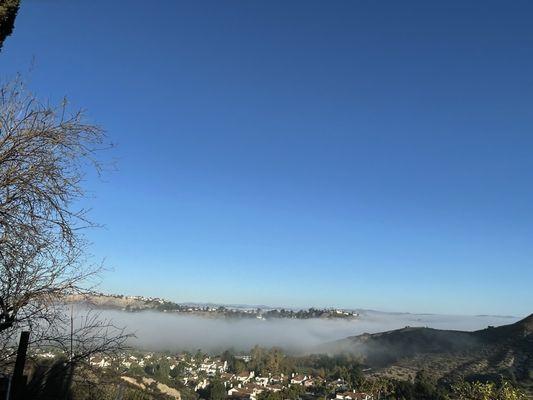 Calabasas village as the morning fog rolls down into the valley below