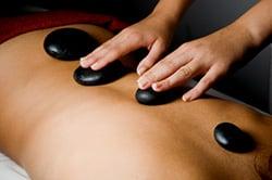 Hot Stone Therapy relaxes tight muscles and soothes your pain.