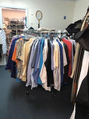 A whole bunch of men's shirts