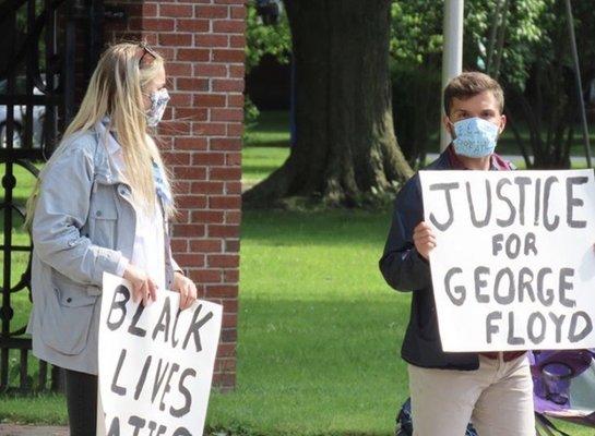 Protestors peacefully standing at Lafayette Park in downtown WG, where they were heckled by a man driving a FingerLakes Roofing Co truck.