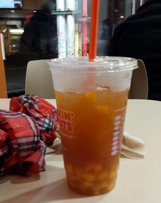 Iced fruit tea with mango and pineapple (the fruit pieces are too big to fit through the straw)