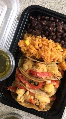 VEGAN Potato Tacos with Spanish brown rice and black beans.