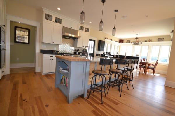 Brand New Home with Custom cabinetry, HIckory floors and lots of natural light!