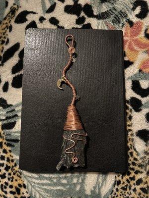 Wire wrapped crystal black kyanite. To make a negativity clearing witches broom. I made this at a class.