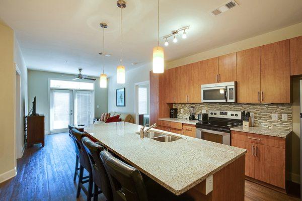 Huge Granite Countertop Bar in Kitchen