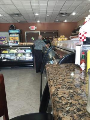 Cute little old man ordering his Sunday breakfast