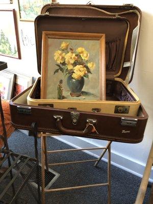 Vintage suitcases and hand-painted art