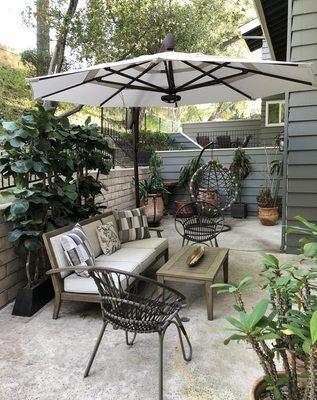 Before view of patio looking toward neighboring condo.