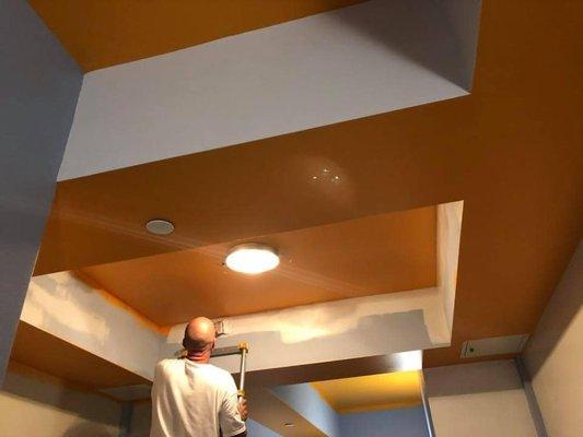 Cutting in ceiling colors at commercial apartment complex.