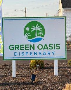 green oasis driveway entrance and sign