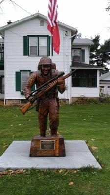 A statue-monument to a fallen veteran in the Marine Corp.Killed in action Iwo Jima 1945. Corporal Robert F. Hodes.