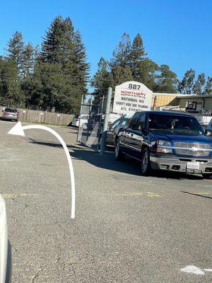 Drive through the gate and the warehouse is on the left