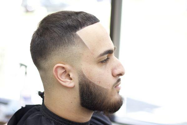 Skin mid fade with beard