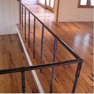 Steel top rail with steel twist pickets