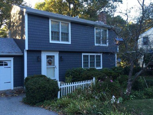 Newly sided colonial in milford with 7" shakes on front and 4" vinyl clapboard on 3 sides