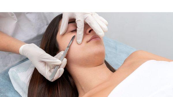 Client receiving a Dermaplane Facial.  You will have smoother, softer skin and removal of facial peach fuzz hair.  You will love your skin.