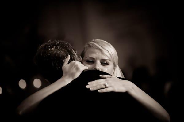 Bride cries as she dances with her father during her Fairmont Olympic Hotel wedding reception.