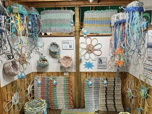 Gypsea Weaver booth in Pirates Plunder. Rope mats, rope baskets, rope jellyfish, rope flowers.