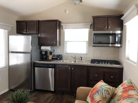 Each kitchen comes equipped with a full-size refrigerator, stove-top oven, microwave and dishwasher.