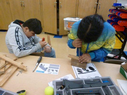 Students are propelled into learning. Here they are redesigning a torsion catapult.